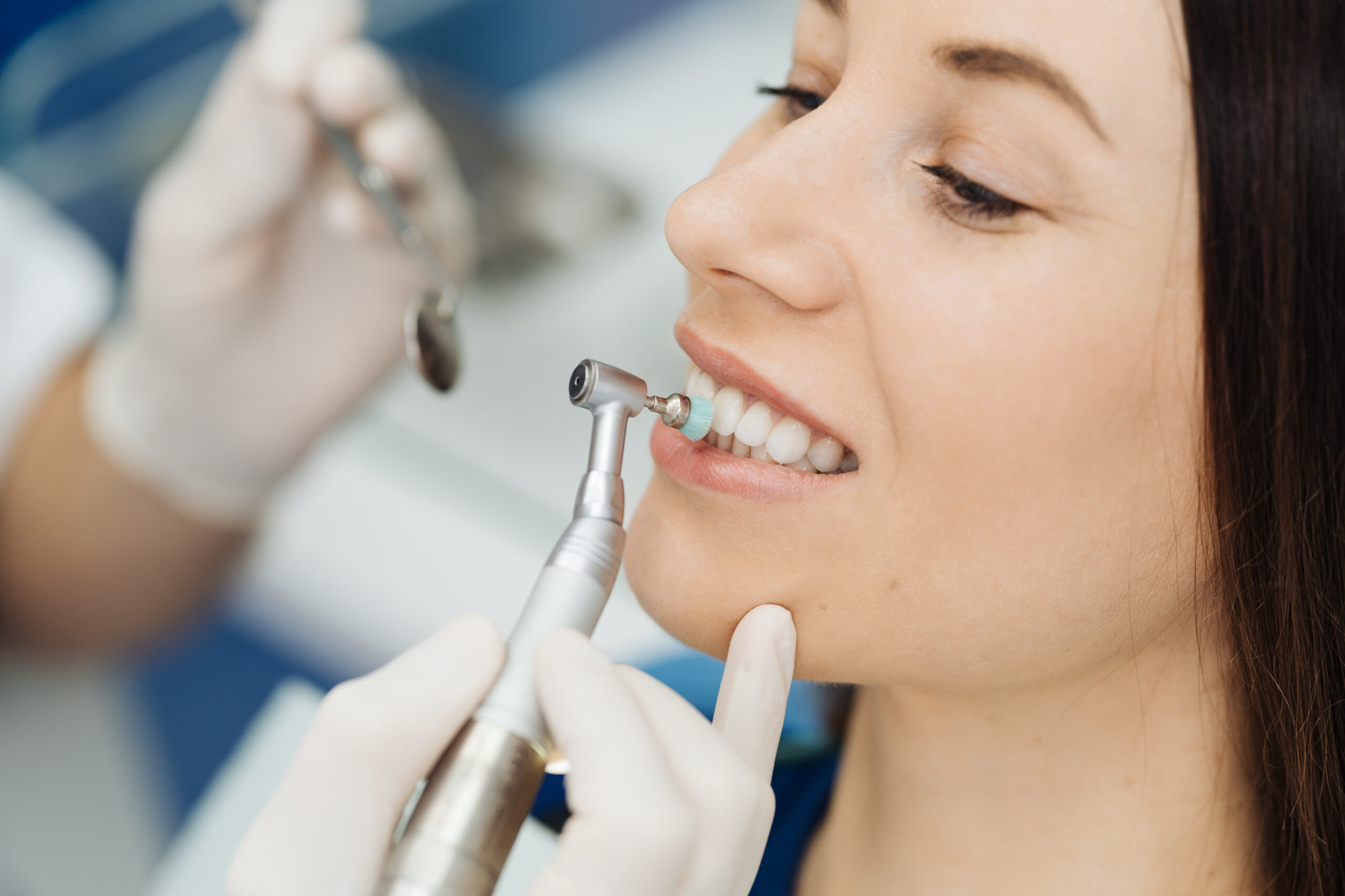 Oral hygiene, dentist doing Scaling and brushing procedure