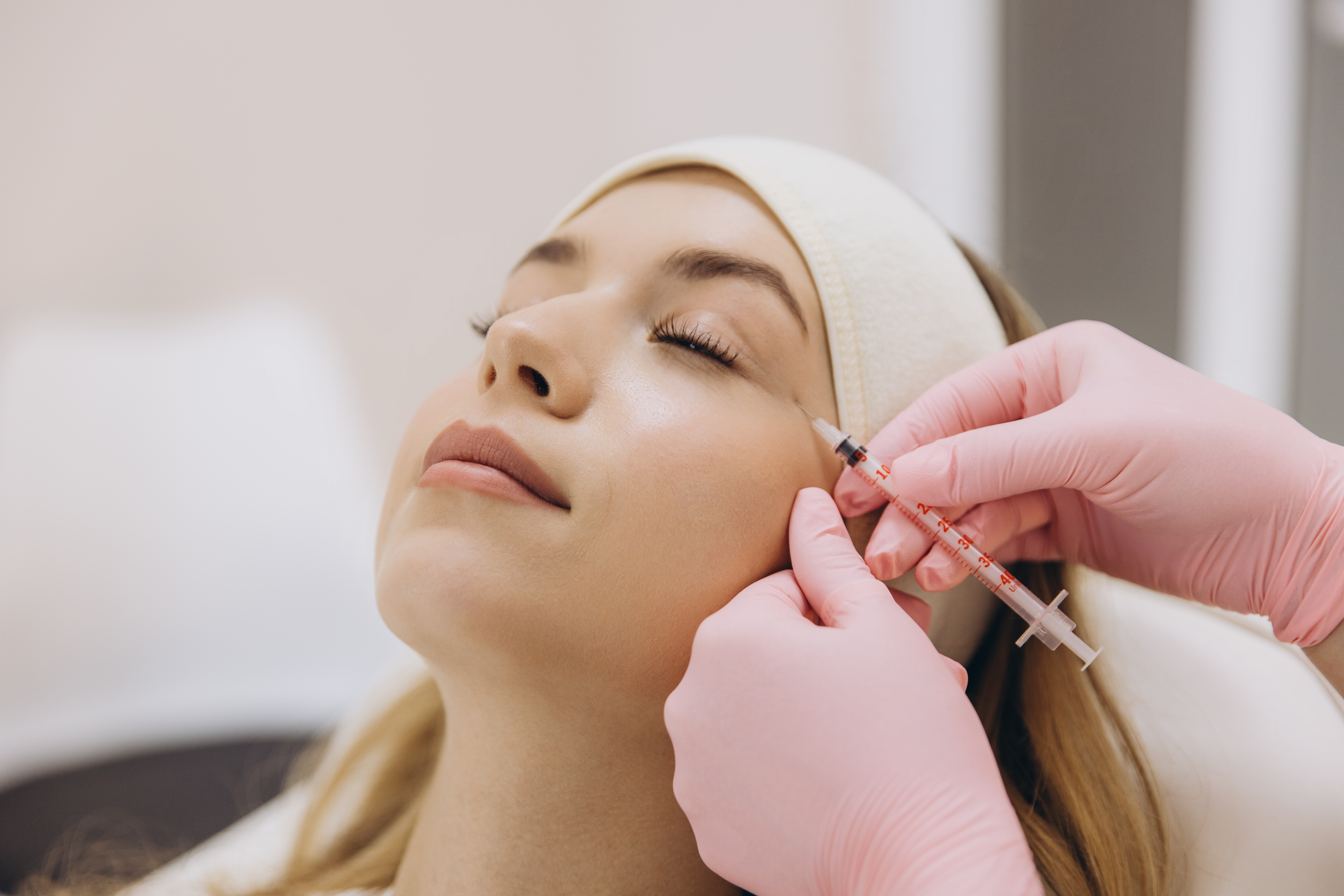 adult woman receives facial injection in clinic 2026 03 09 02 54 57 utc